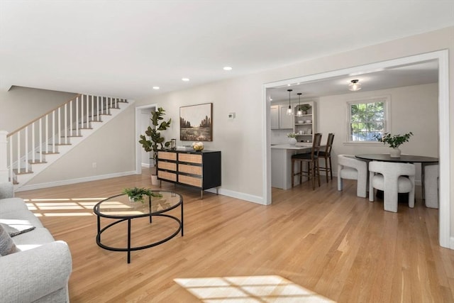 110 Westover Pkwy, Norwood, MA 02062 - living area featuring light wood-style flooring, baseboards, recessed lighting, and stairs