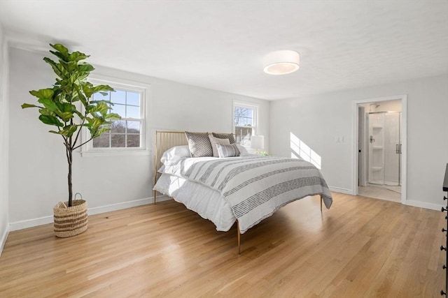 110 Westover Pkwy, Norwood, MA 02062 - bedroom with connected bathroom, baseboards, and light wood-style flooring