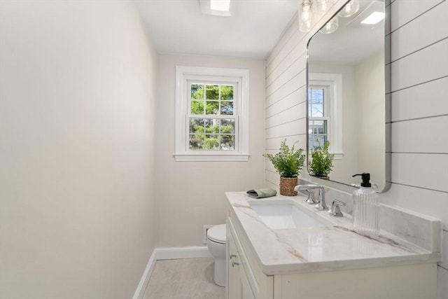 110 Westover Pkwy, Norwood, MA 02062 - bathroom featuring tile patterned flooring, vanity, toilet, and baseboards
