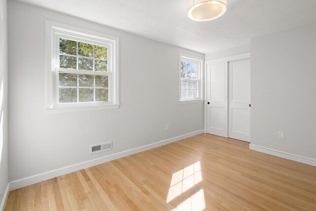 110 Westover Pkwy, Norwood, MA 02062 - unfurnished bedroom featuring baseboards, light wood-style floors, and visible vents