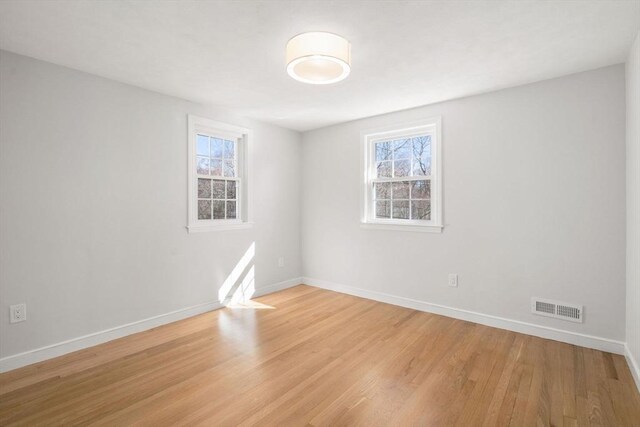 110 Westover Pkwy, Norwood, MA 02062 - unfurnished room with visible vents, light wood finished floors, and baseboards