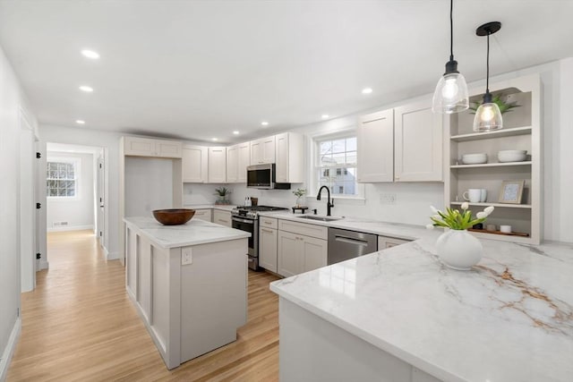 110 Westover Pkwy, Norwood, MA 02062 - kitchen featuring light stone counters, a sink, recessed lighting, and appliances with stainless steel finishes