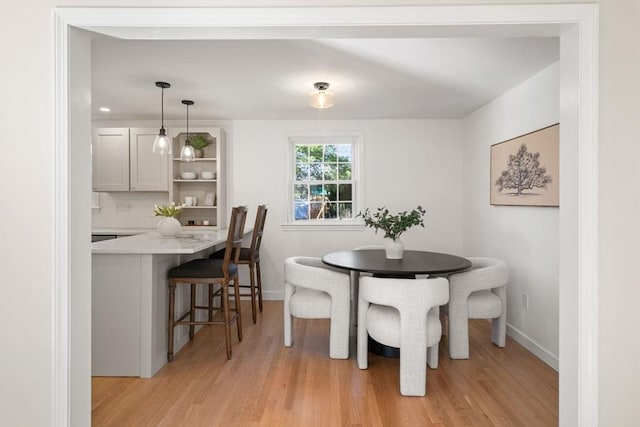 110 Westover Pkwy, Norwood, MA 02062 - dining room featuring baseboards and light wood finished floors