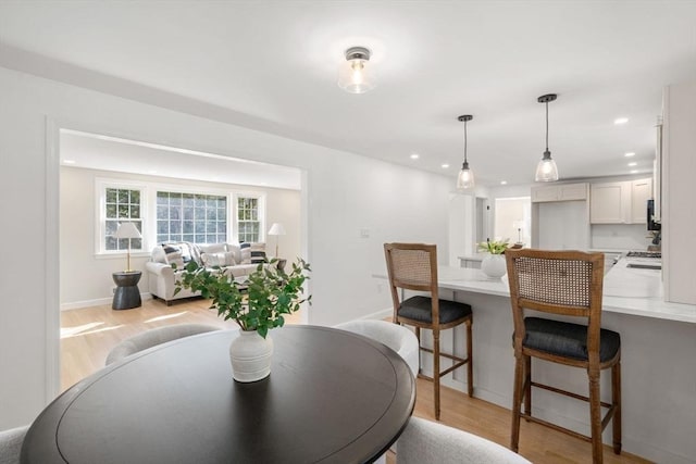 110 Westover Pkwy, Norwood, MA 02062 - dining room with recessed lighting, light wood finished floors, and baseboards