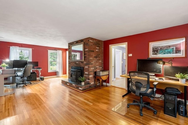 495 Grafton St, Shrewsbury, MA 01545 - office with wood finished floors, a wood stove, and baseboards