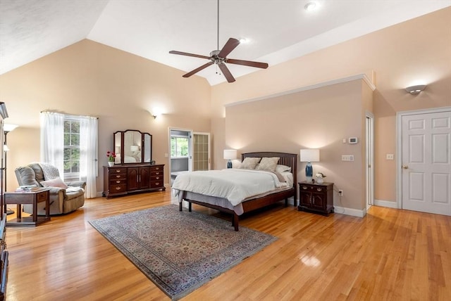 495 Grafton St, Shrewsbury, MA 01545 - bedroom with high vaulted ceiling, light wood-style flooring, multiple windows, and baseboards