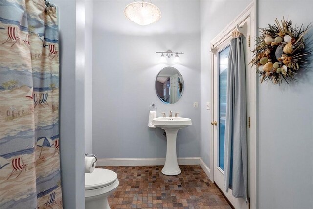 495 Grafton St, Shrewsbury, MA 01545 - bathroom featuring toilet and baseboards