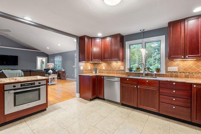 495 Grafton St, Shrewsbury, MA 01545 - kitchen with open floor plan, vaulted ceiling, a sink, and appliances with stainless steel finishes