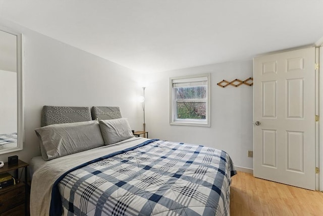 bedroom featuring light wood-style flooring