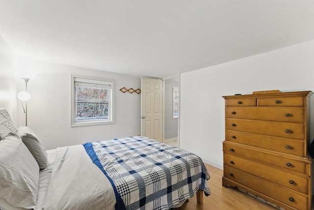bedroom featuring light wood-style floors