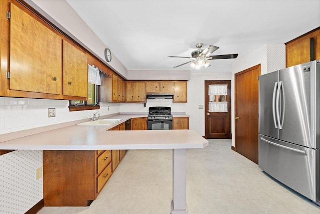 13 Abraham Ave, Freetown, MA 02717 - kitchen with freestanding refrigerator, black range with gas cooktop, light countertops, a peninsula, and ceiling fan