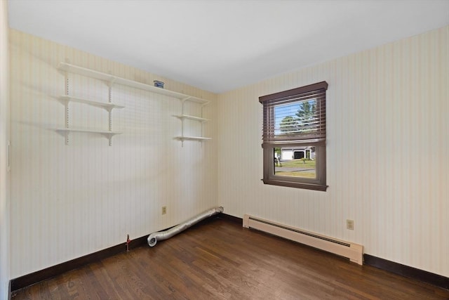 13 Abraham Ave, Freetown, MA 02717 - spare room with a baseboard heating unit, dark wood finished floors, and wallpapered walls