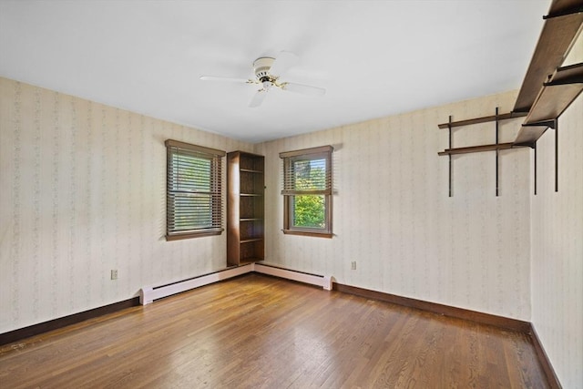 13 Abraham Ave, Freetown, MA 02717 - empty room featuring wood finished floors, a ceiling fan, wallpapered walls, and a baseboard radiator