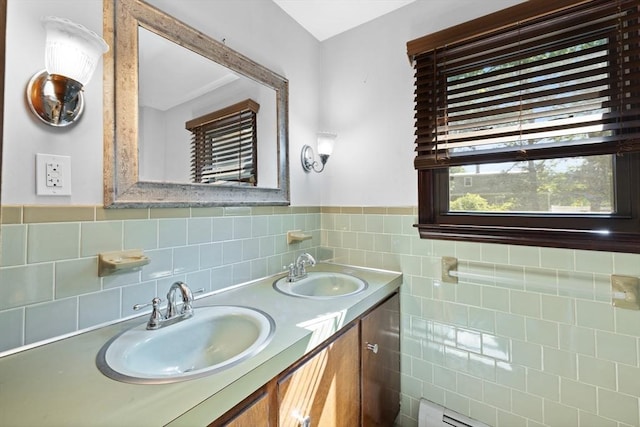 13 Abraham Ave, Freetown, MA 02717 - bathroom with double vanity, tile walls, and a baseboard radiator