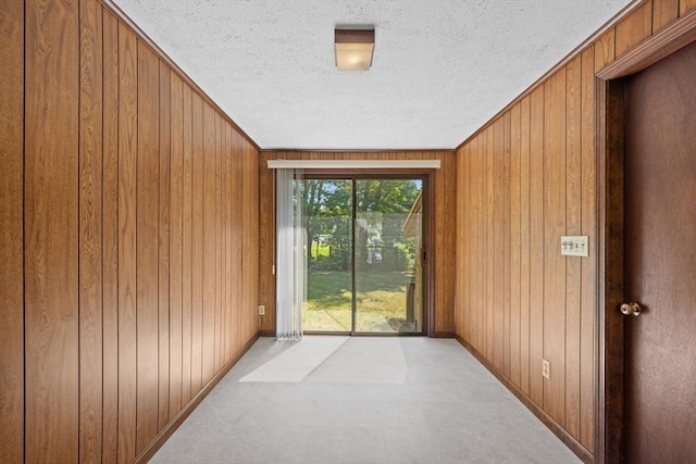 13 Abraham Ave, Freetown, MA 02717 - corridor featuring a textured ceiling and wood walls