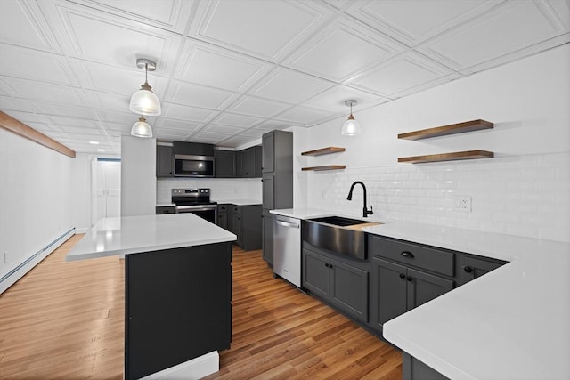 13 Abraham Ave, Freetown, MA 02717 - kitchen featuring stainless steel appliances, open shelves, tasteful backsplash, light wood finished floors, and light countertops