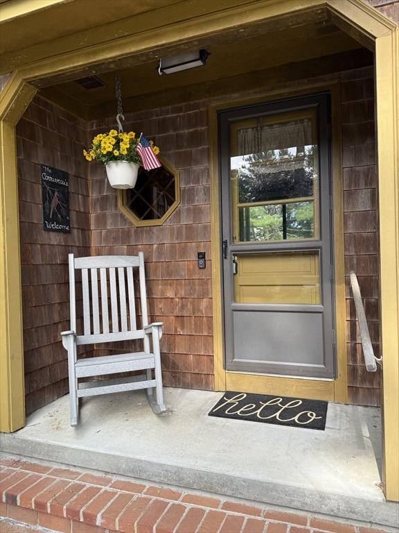 13 Abraham Ave, Freetown, MA 02717 - view of exterior entry featuring a porch