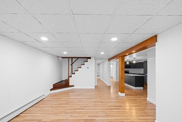 13 Abraham Ave, Freetown, MA 02717 - finished basement featuring a baseboard radiator, light wood-type flooring, stairs, recessed lighting, and a drop ceiling
