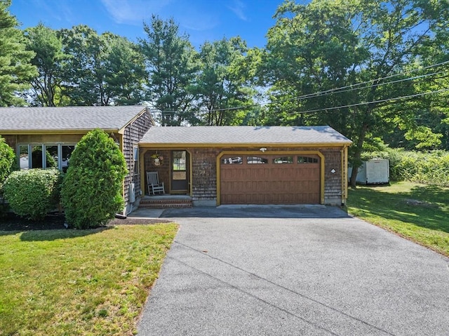 13 Abraham Ave, Freetown, MA 02717 - view of front of house featuring driveway, a garage, and a front yard