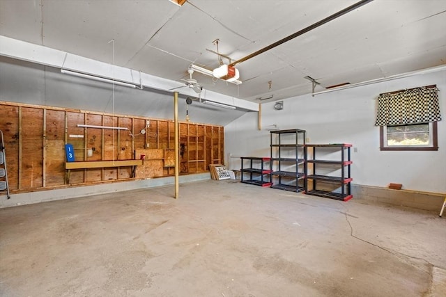13 Abraham Ave, Freetown, MA 02717 - garage featuring a workshop area and a garage door opener