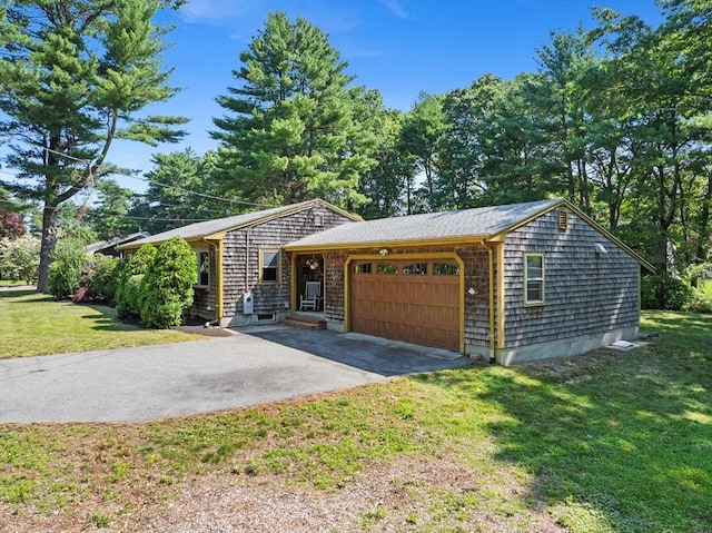 13 Abraham Ave, Freetown, MA 02717 - view of side of home featuring a garage, driveway, and a lawn