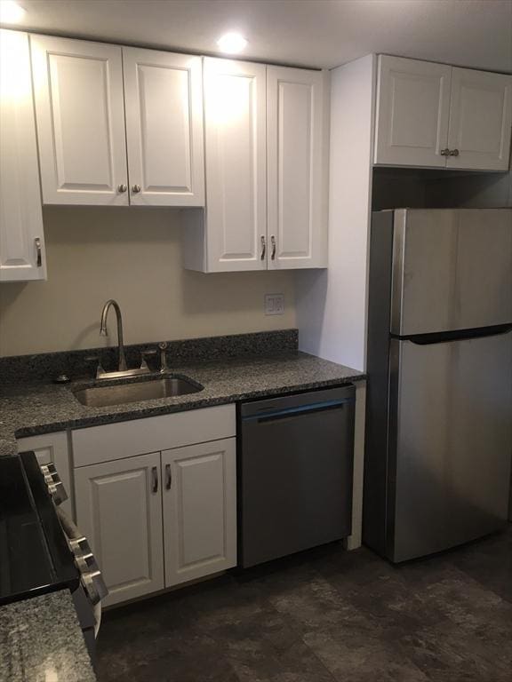 881 Main St Unit U10, Walpole, MA 02081 - kitchen with stainless steel appliances, white cabinets, and dark stone counters