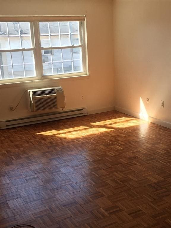 881 Main St Unit U10, Walpole, MA 02081 - spare room with a wall mounted AC and a baseboard heating unit