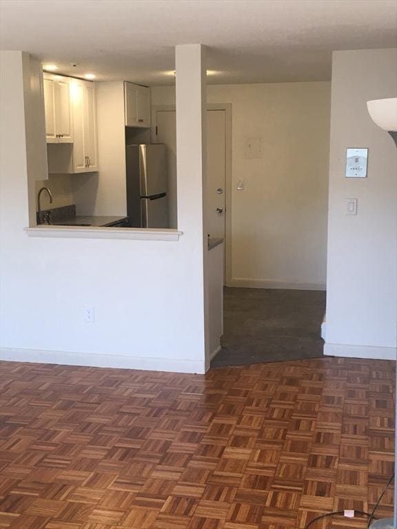 881 Main St Unit U10, Walpole, MA 02081 - kitchen featuring freestanding refrigerator and white cabinetry