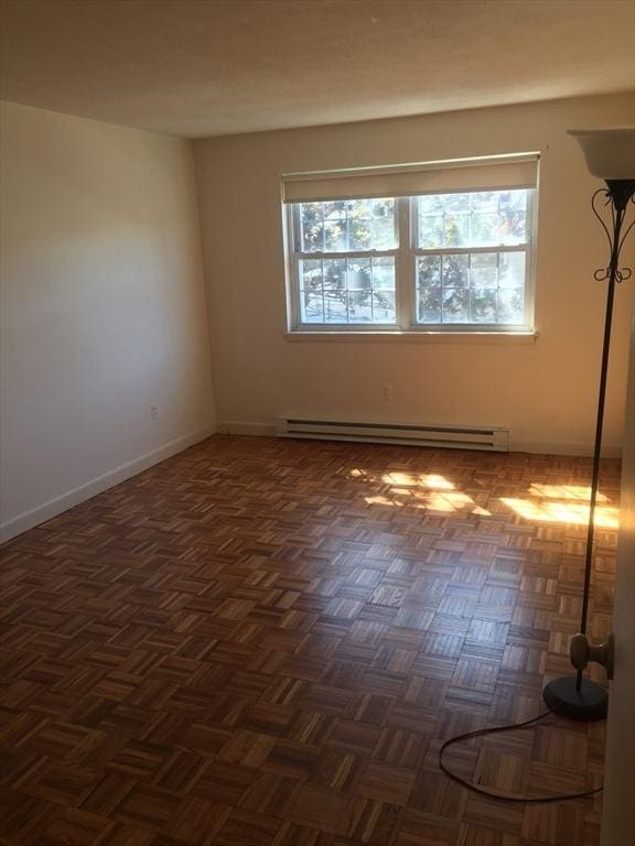 881 Main St Unit U10, Walpole, MA 02081 - spare room with a baseboard heating unit and plenty of natural light