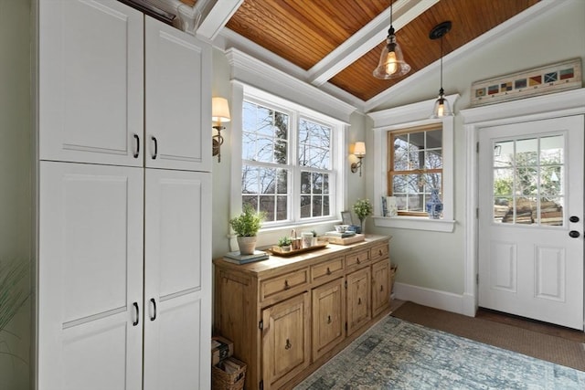 interior space featuring lofted ceiling with beams, baseboards, and wood ceiling