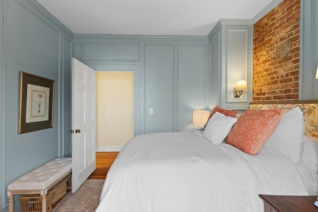 bedroom with brick wall and a decorative wall