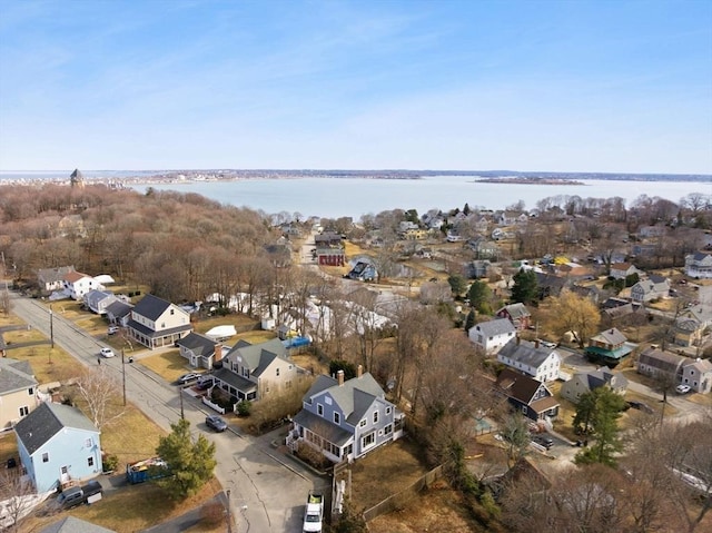 bird's eye view with a residential view and a water view