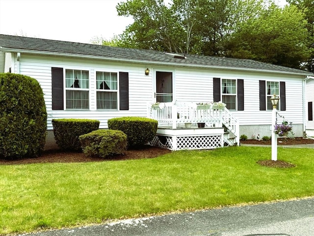 38 Trailwood Dr, Bridgewater, MA 02324 - view of front of home featuring a front lawn and a deck