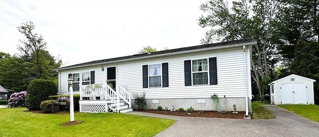 38 Trailwood Dr, Bridgewater, MA 02324 - view of front of house featuring a storage unit, crawl space, and a front lawn