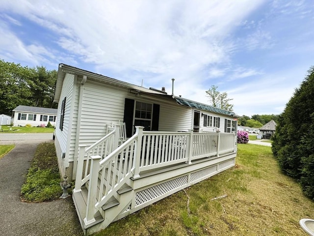 38 Trailwood Dr, Bridgewater, MA 02324 - rear view of property with a lawn and a deck