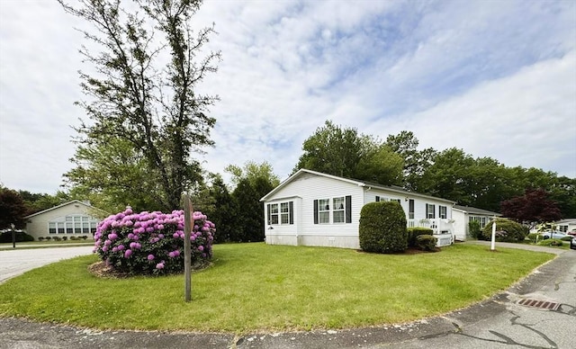 38 Trailwood Dr, Bridgewater, MA 02324 - view of side of property with a lawn