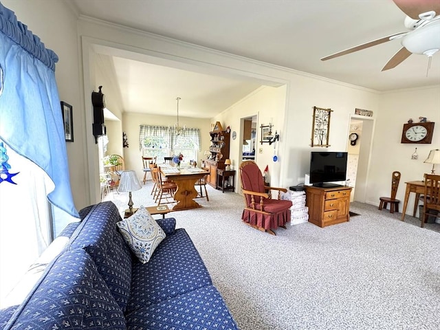 38 Trailwood Dr, Bridgewater, MA 02324 - living area with light carpet, crown molding, a ceiling fan, and a chandelier