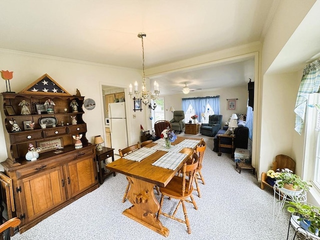 38 Trailwood Dr, Bridgewater, MA 02324 - dining area featuring light colored carpet, a chandelier, ornamental molding, and a ceiling fan