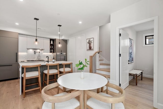 dining room featuring light hardwood / wood-style flooring