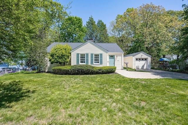 191 Speen, Natick, MA 01760 - view of front of house featuring an outdoor structure, driveway, a front yard, and a garage