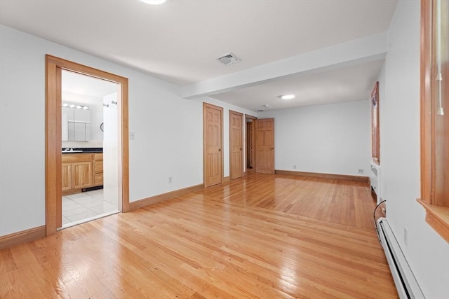 191 Speen, Natick, MA 01760 - unfurnished room with a baseboard heating unit, light wood finished floors, and baseboards