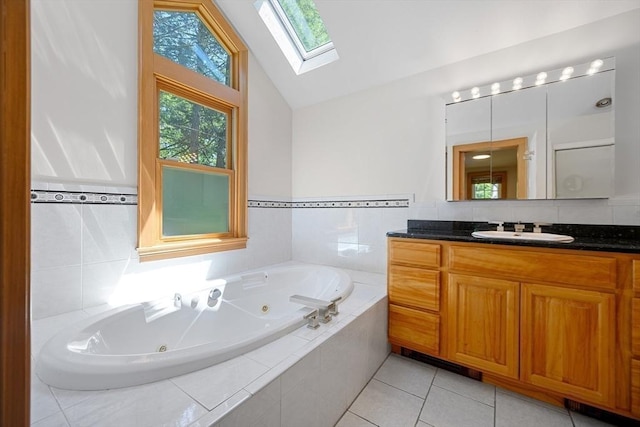 191 Speen, Natick, MA 01760 - bathroom featuring a skylight, lofted ceiling, a tub with jets, tile patterned flooring, and vanity