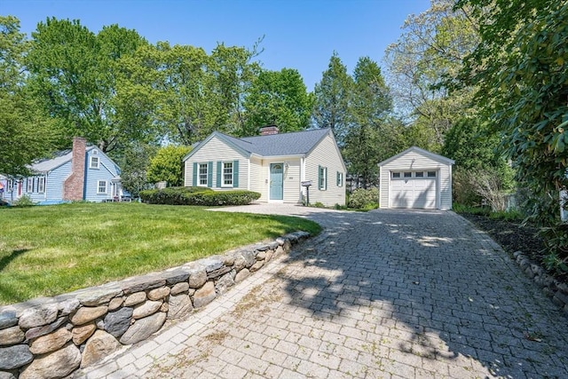 191 Speen, Natick, MA 01760 - view of front of property with an outdoor structure, a front yard, decorative driveway, a chimney, and a garage
