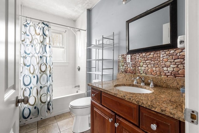 full bathroom featuring toilet, tile patterned flooring, shower / bath combo with shower curtain, and vanity