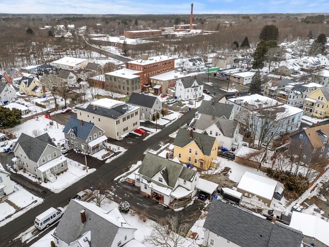 snowy aerial view with a residential view