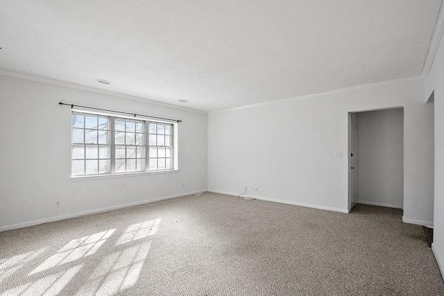 carpeted empty room with crown molding