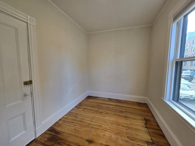 98 Boylston St Unit 1, Brookline, MA 02445 - empty room with hardwood / wood-style floors, crown molding, and baseboards
