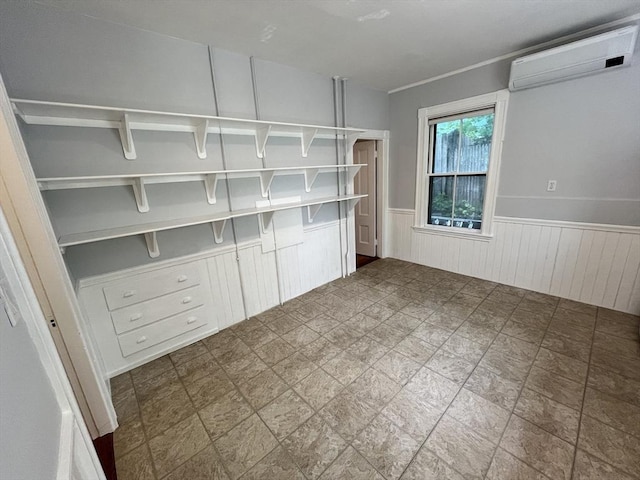 98 Boylston St Unit 1, Brookline, MA 02445 - spare room with a wainscoted wall and a wall mounted AC