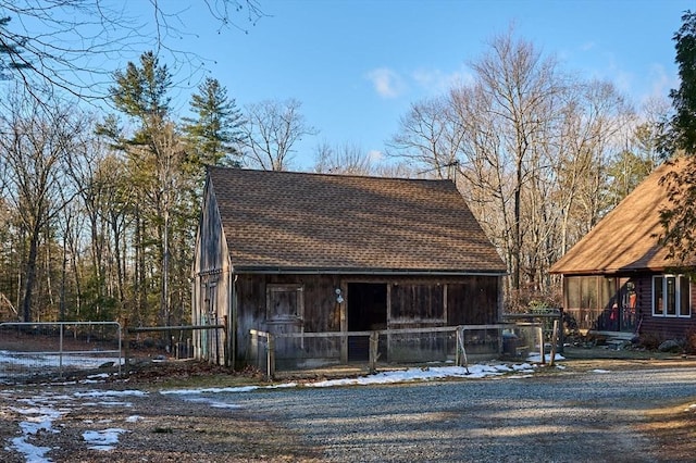 view of front facade featuring an outbuilding