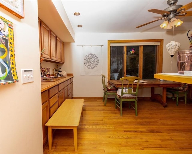 dining space featuring light wood-type flooring, ceiling fan, and recessed lighting